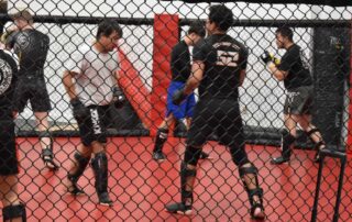 Scottsdale training session showing mixed martial artists building strength and endurance.