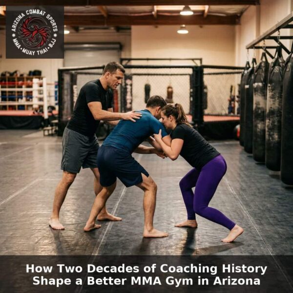 MMA coach guiding two adult students through clinch-to-ground technique at Arizona Combat Sports, a long-established MMA gym in Arizona